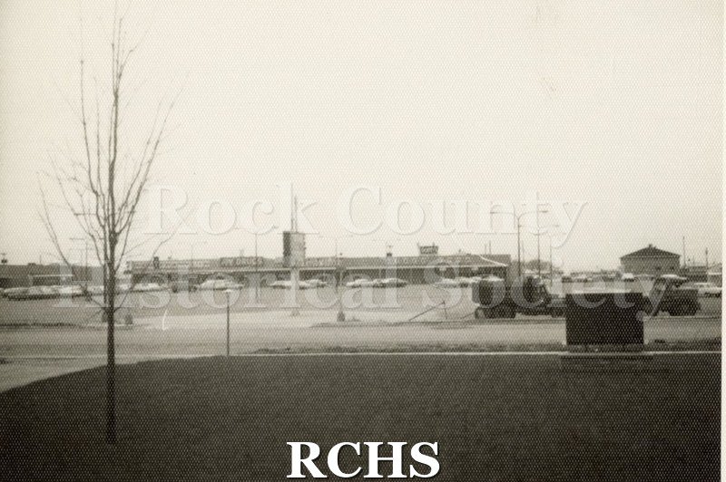 Black and white photograph of the Blackhawk Shopping Center, Janesville, WI, from a distance.