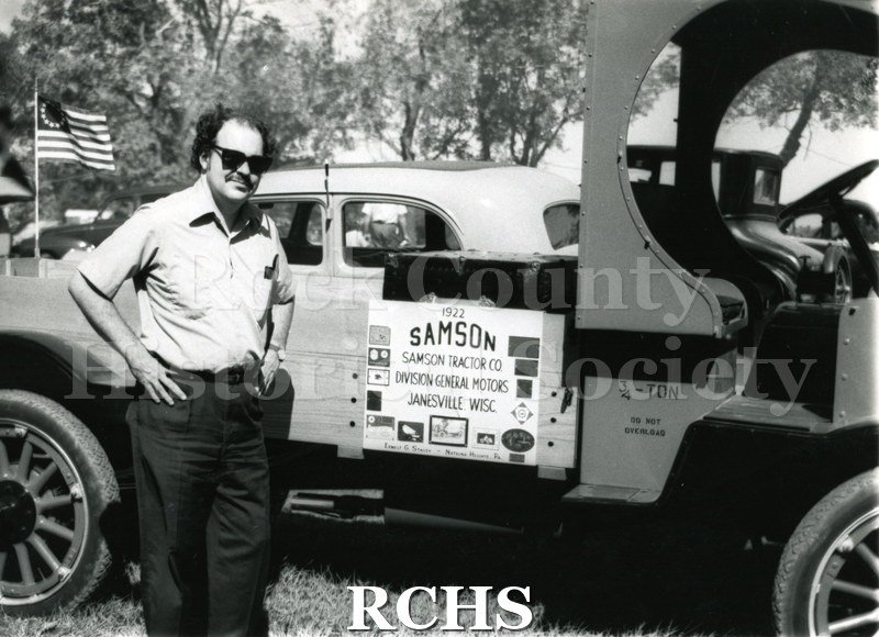 Black and white photograph of Richard Hartung standing beside a 1922 Samson truck. On the side is a sign: "1922 Samson Samson Tractor Co.