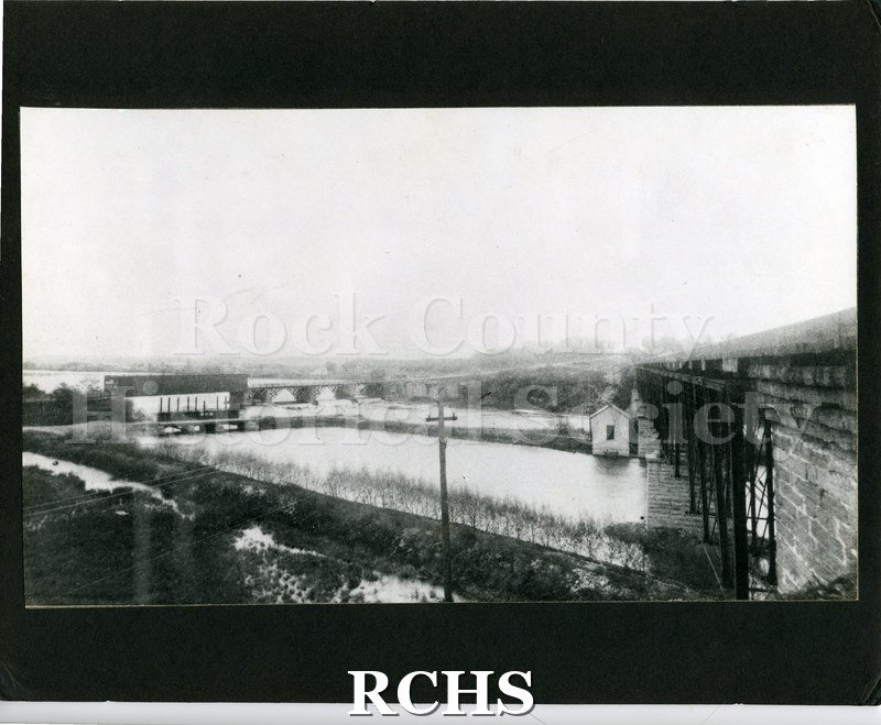 Historic image of Black and white photogrpah of the Center Avenue covered bridge at Monterey over the river.