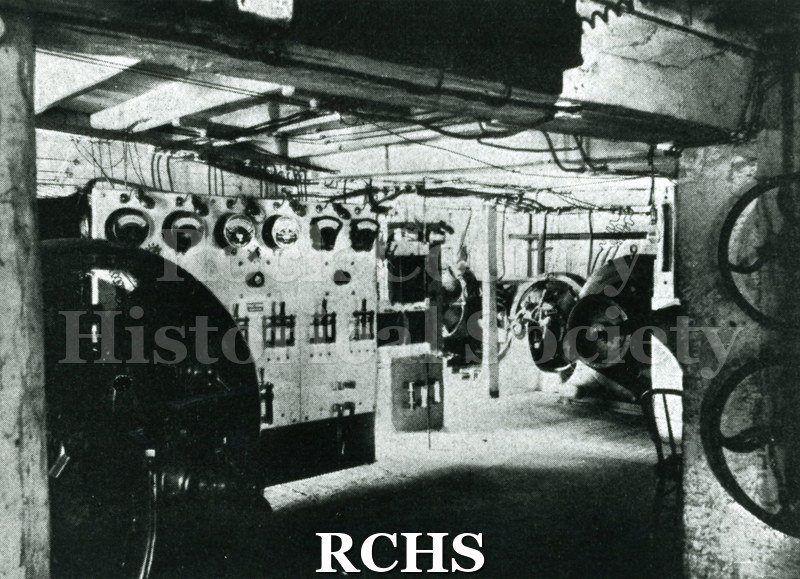 Historic image of CBlack and white copy print of the controls of a water power plant.