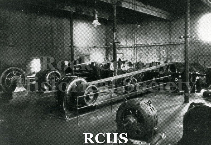 Historic image of Black and white copy print of the interior of an electrical plant.