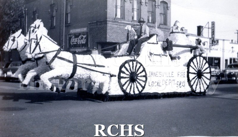 Historic image of Black and white copy print of a parade float from the Janesville Fire Local Dept. 580.