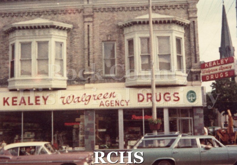 Color photo of the sign for Kealey Drugstore. Along the whole front in red letters: "Kealey Walgreen Agency Drugs".