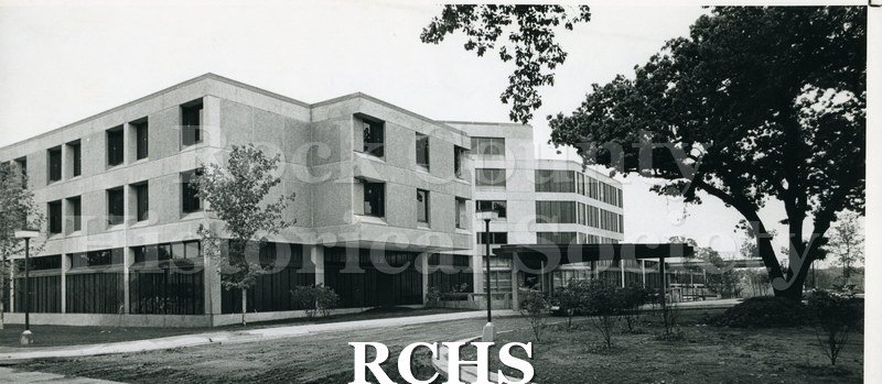 Black and white photograph of Mercy Hospital showing the front entrance.