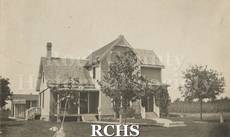 Black and white photograph of the Jas. A. Kipp home. Shows a two story house. There is a porch on the left and one on the right.