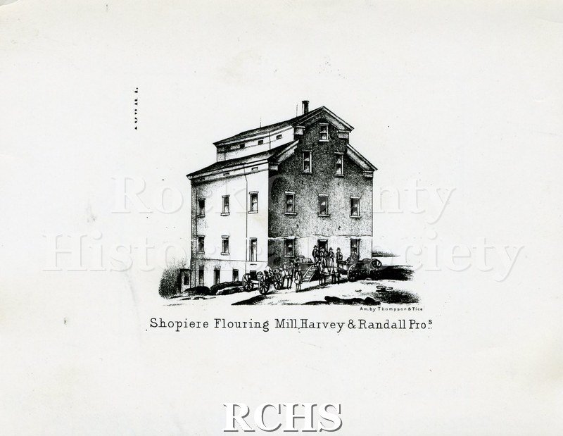 Historic image of Copy print of Shopiere Flouring Mill, a three story building. On bottom: "Shopiere Flouring Mill Harvey & Randall Pros".