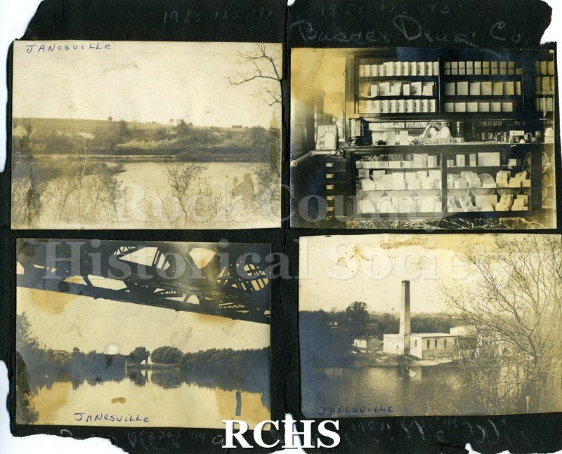 Black and white photograph of Rock River in Janesville, WI. Shows landscape with river in front and trees in background.