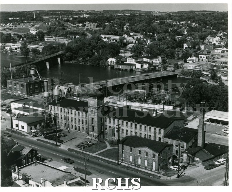 Black and white aerial view of Janesville Cotton Company, North Franklin Street. Shows the three story building with tower.