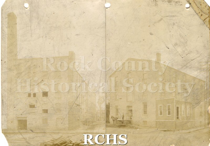 Black and white photograph of Rock River Cotton Company. The photograph on the right is of a three story building with an open door.
