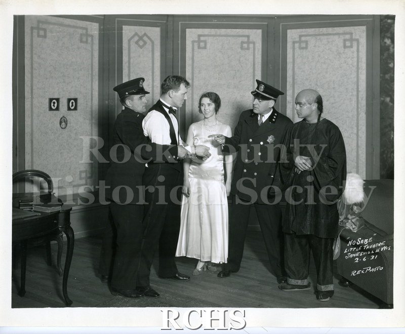 Black and white photograph of a scene from the play, "No Sabe." Notation on lower right corner of photo: "NO SABE LITTLE THEATRE JANESVILLE WIS 2-6-31 REX PHOTO".