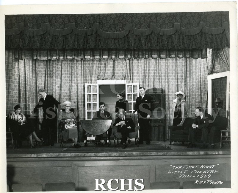 Black and white photograph of a scene from Janesville Little Theatre's 1934 production of "The First Night." Notation on lower right corner of photo: "THE FIRST.