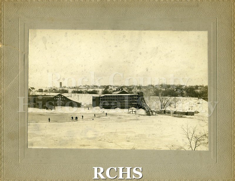 Black and white photograph of Ice Harvest in Jansville, WI ca 1907. Shows cutting ice on Rock River.