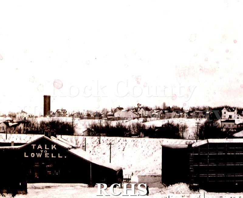 Historic image of Black and white copy print of Ice Harvest in Janesville, WI ca 1907. Shows cutting ice on Rock River.