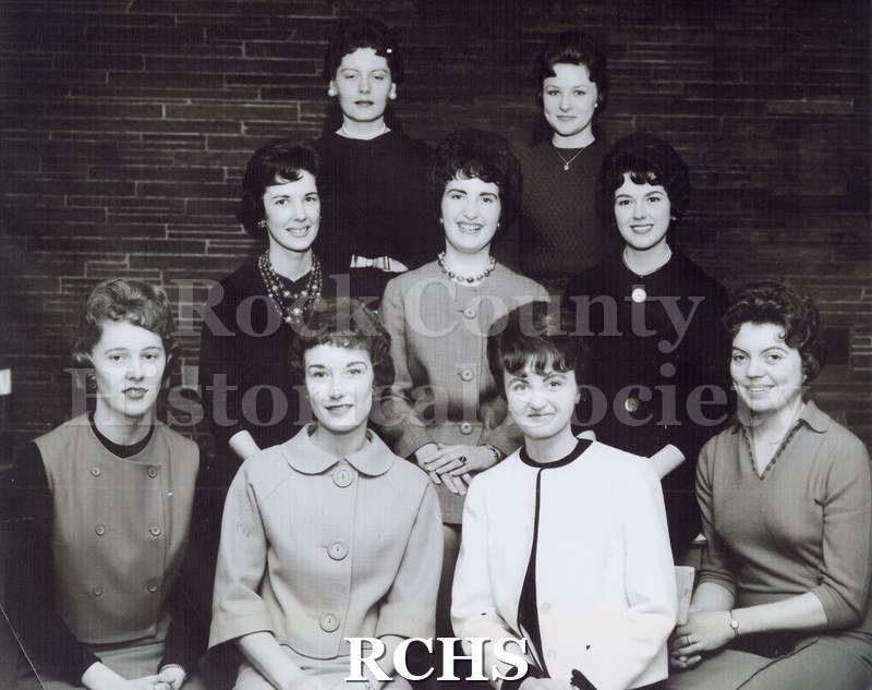 Black and white photograph of Miss Pennette Barbara Heilman and court. Shows 9 women, standing and seated.