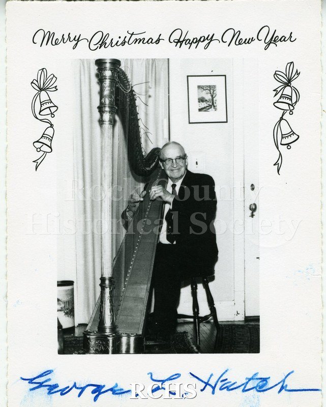 Historic image of Christmas Card of George L. Hatch playing the harp in the parlor of the Lincoln Tallman House.