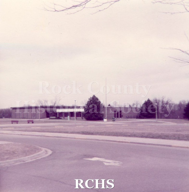 Pinkish photograph of Blackhawk Tech Hyatt Smith Hall. Transcription.