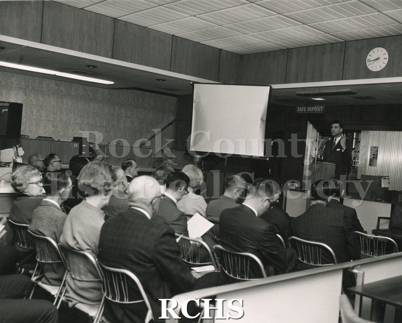 Black and white photograph of Robert Ruth addressing an audience.