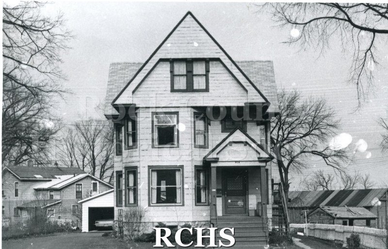 Black and white photograph of 916 Mineral Point, Janesville, WI (demolished c. August 1, 1971). Shows a three story house with shingle-type siding.