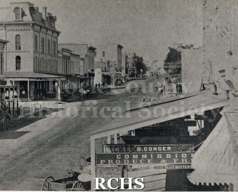 Black and white photograph of Early Janesvillle, possibly looking down Milwaukee Street.