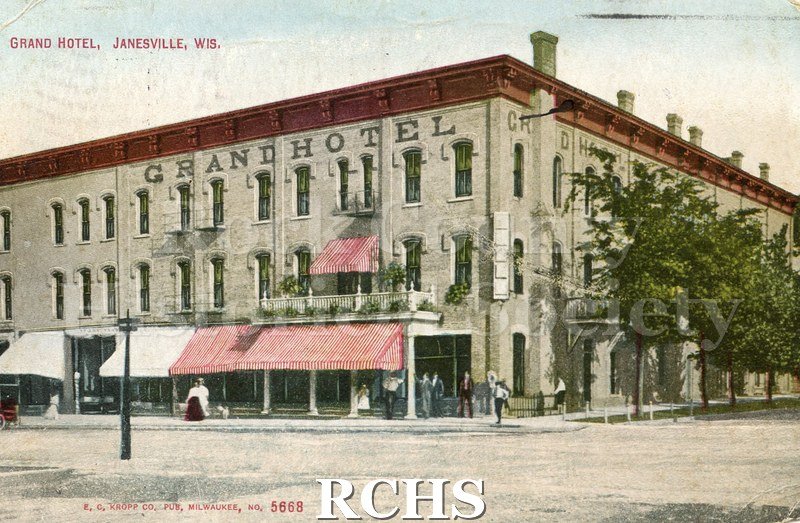 Color postcard of "Grand Hotel, Janesville, Wis." in red on upper left of card. Lower left "E.C. Kropp Co., Pub, Milwaukee, Wis. 5668".
