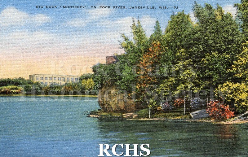 Postcard of Big Rock "Monterey" on the Rock River. Building in background on left. Large rock and trees sticking out on land to the right.