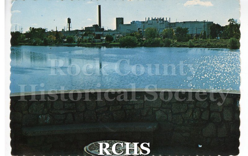 Post Card of Big Rock at Monterey Park. Shows memorial plaque and view across the river. Water tower on back left. Reverse has no writing, postmark or stamp.