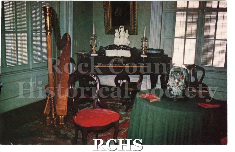 Historic image of Post Card of Tallman House front parlor interior. Short paragraph on the Tallman house on reverse. Reverse has no writing, postmark or stamp.