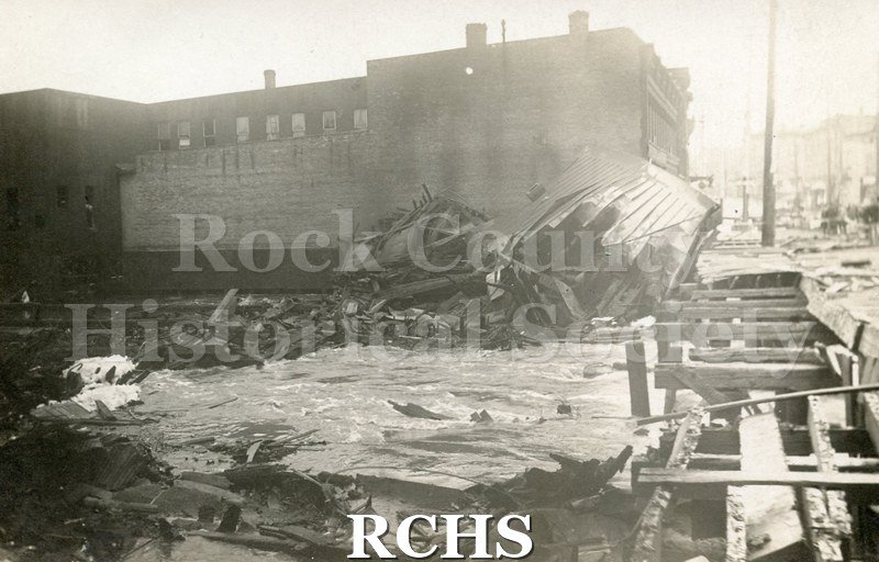 Postcard. Black and white photograph of the wreckage after the Milwaukee Street fire in April 1913.