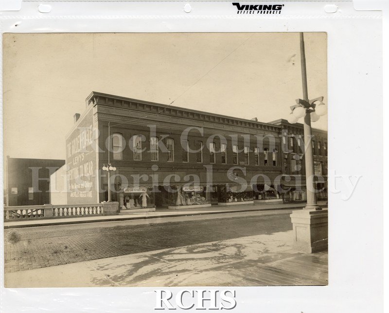 Historic image of Milwaukee Street with Golden Eagle building on left side.