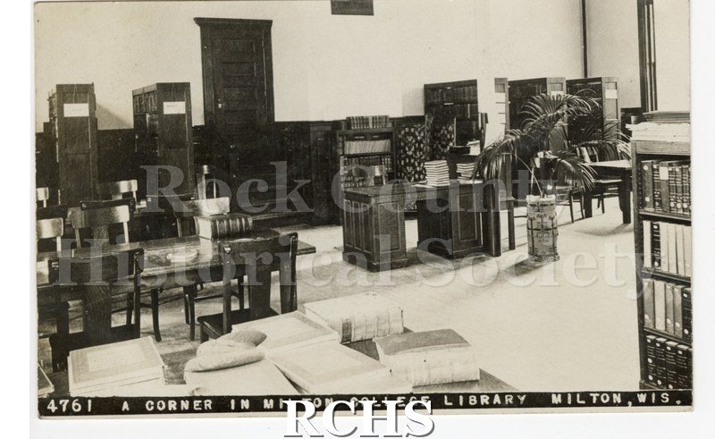 Postcard. Black and white photograph of A Corner in the Library of Milton College.