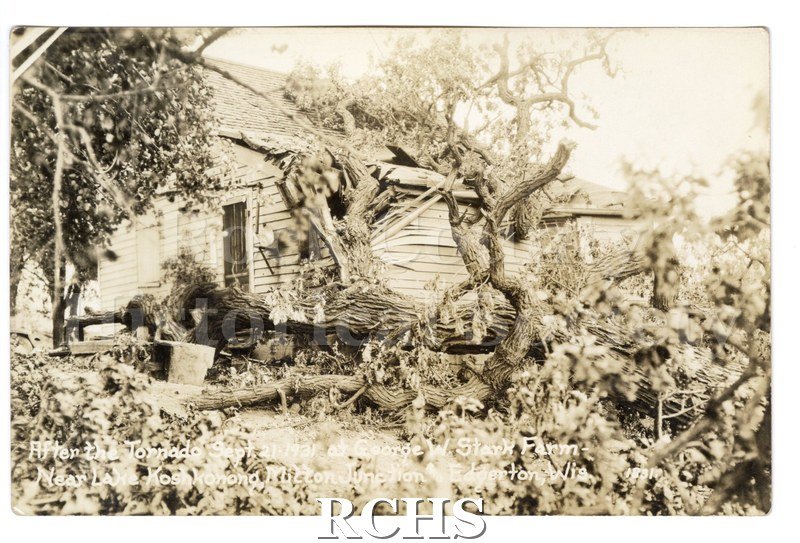 3-1/2" x 5-1/2" glossy picture postcard showing remains of farmhouse after tornado. There are trees uprooted in the yard. On bottom: "After the Tornado Sept.
