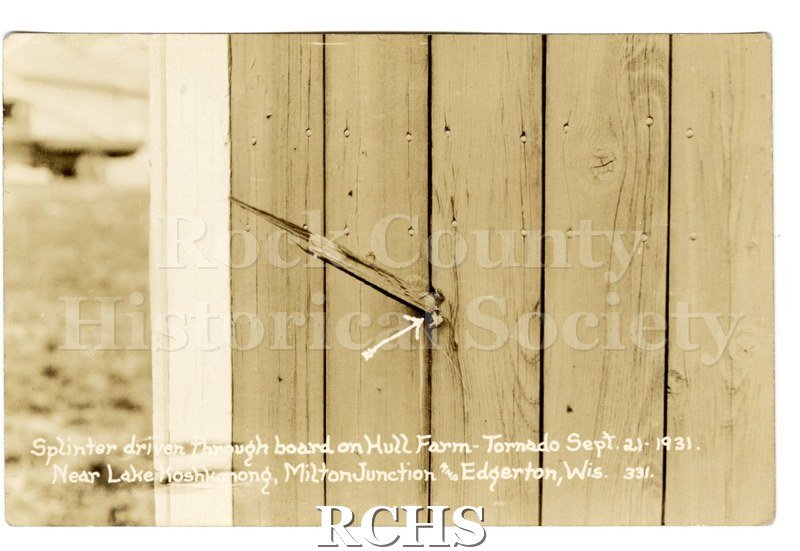 3-1/2" x 5-1/2" glossy picture postcard close-up of a fence with a splinter in it from the tornado.