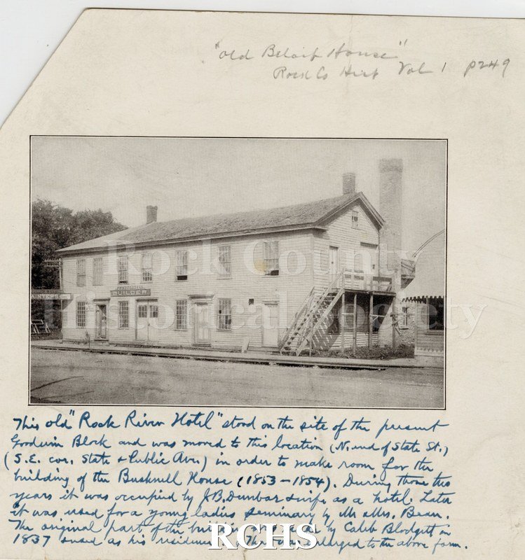 Black and white photograph of Rock River Hotel, Beloit, WI, a two story building with an outdoor stairway up to the second floor.