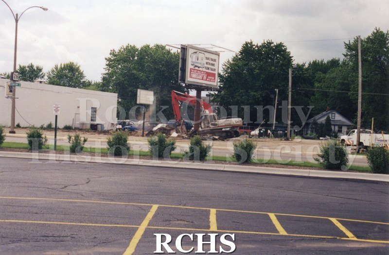 Color photo of demolition of Slick's Bar, Milton Avenue. Bar owned by Dean Richards and Jim Comstock. Leased from Joe Adamany.