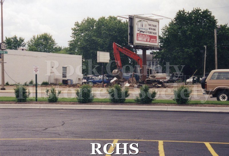 Color photo of demolition of Slick's Bar, Milton Avenue. Bar owned by Dean Richards and Jim Comstock. Leased from Joe Adamany.