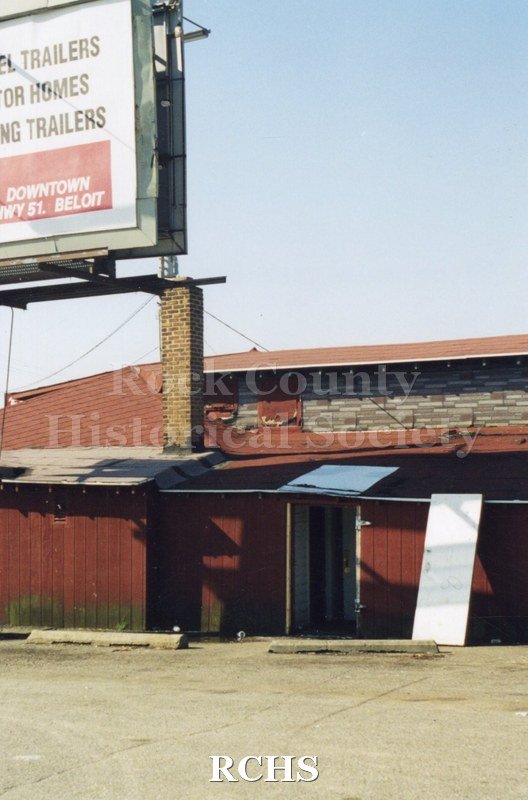 Color photo of demolition of Slick's Bar, Milton Avenue. Bar owned by Dean Richards and Jim Comstock. Leased from Joe Adamany.