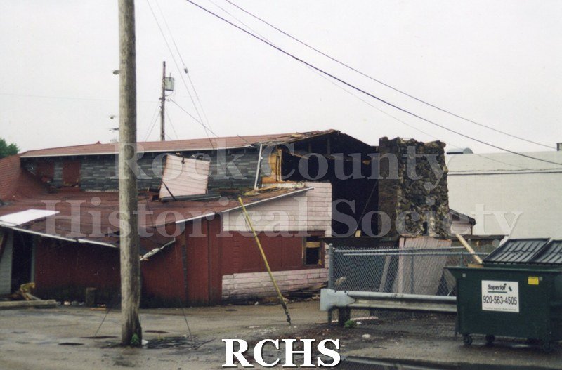 Color photo of demolition of Slick's Bar, Milton Avenue. Bar owned by Dean Richards and Jim Comstock. Leased from Joe Adamany.