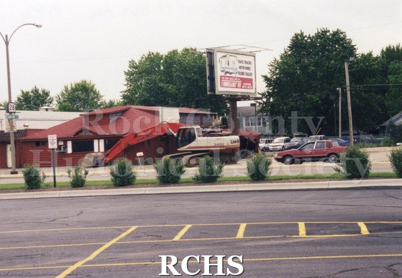Color photo of demolition of Slick's Bar, Milton Avenue. Bar owned by Dean Richards and Jim Comstock. Leased from Joe Adamany.