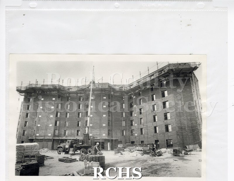 Black and white photograph of construction of Janesville Garden Court Apartments.