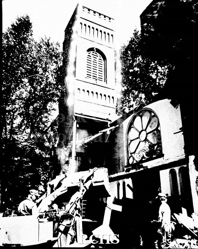 Grayscale. Image depicts the demolition of a church.