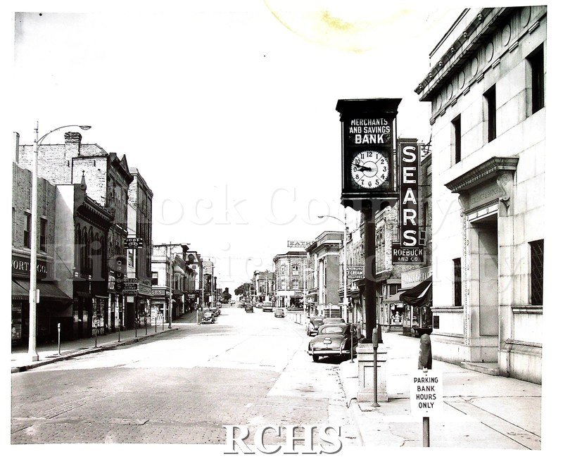 Black and white photograph of W. Milwaukee Street, Janesville, WI Center of business district Sears Roebuck and Co.